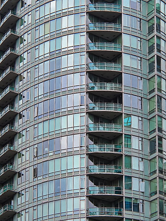 Modern Glass High-Rise Building with Curved Balconies