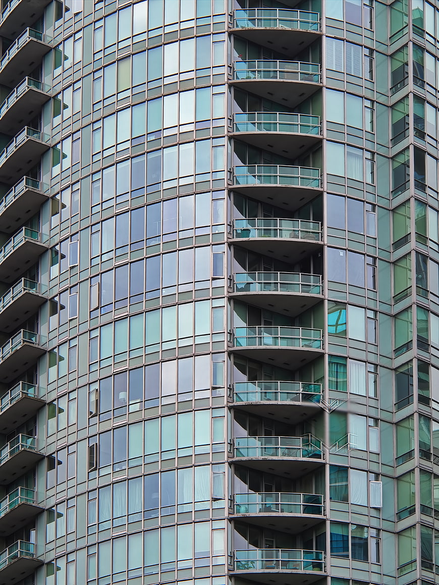 Modern Glass High-Rise Building with Curved Balconies