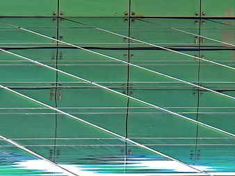 Abstract Green Glass Building Facade with Diagonal Lines