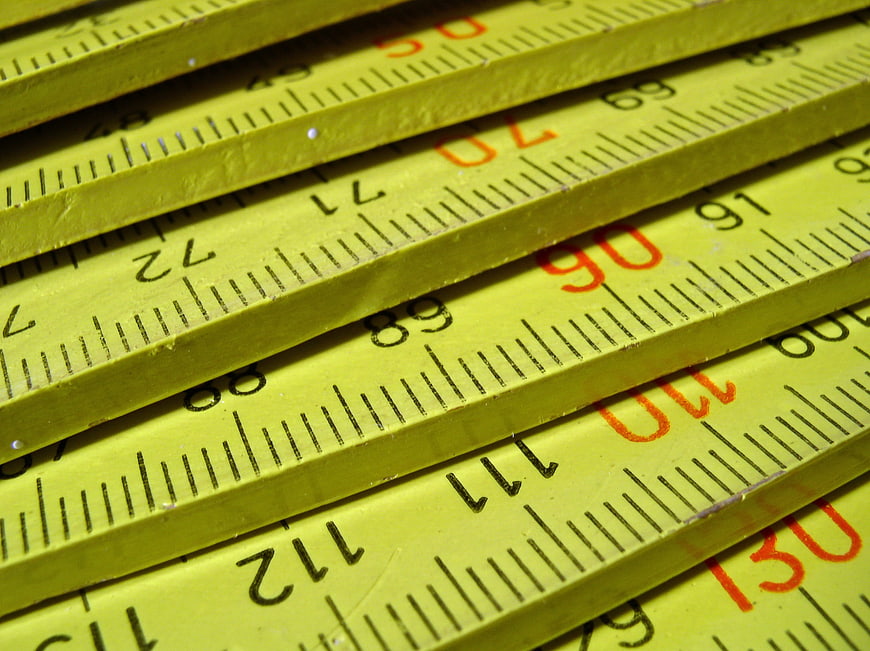 Close-up of yellow folding ruler with measurement markings