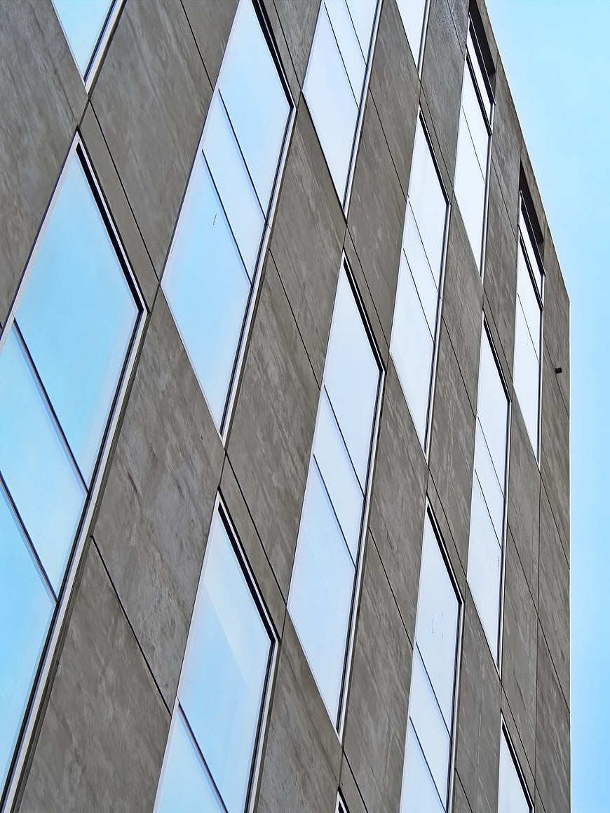 Modern Concrete Building Facade with Glass Windows
