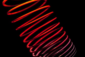 Abstract Red Spiral Light Trail on Black Background