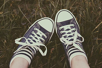 Blue Canvas Sneakers on Grass with Striped Socks