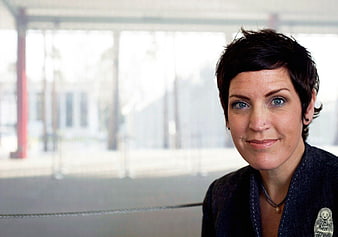 Portrait of woman with short hair looking at camera