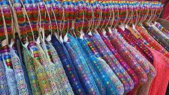 Colorful Beaded Clothing Display On Hangers