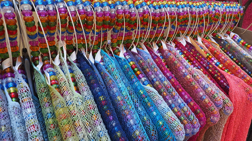 Colorful Beaded Clothing Display On Hangers