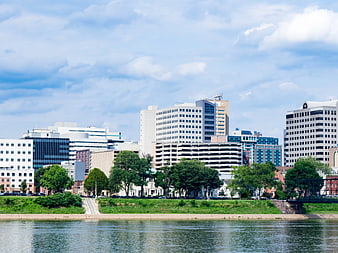 City Skyline Across River with Blue Sky