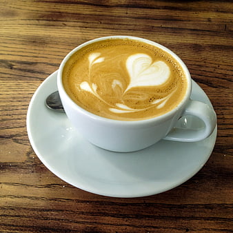 White Cup of Latte Art on Rustic Wooden Table