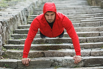 Athletic Man Doing Pushups on Outdoor Stone Stairs