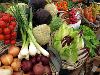 Fresh Organic Vegetables Displayed In Wicker Baskets At Farmers Market