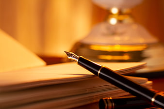 Fountain Pen Resting On Stack Of Paper Documents