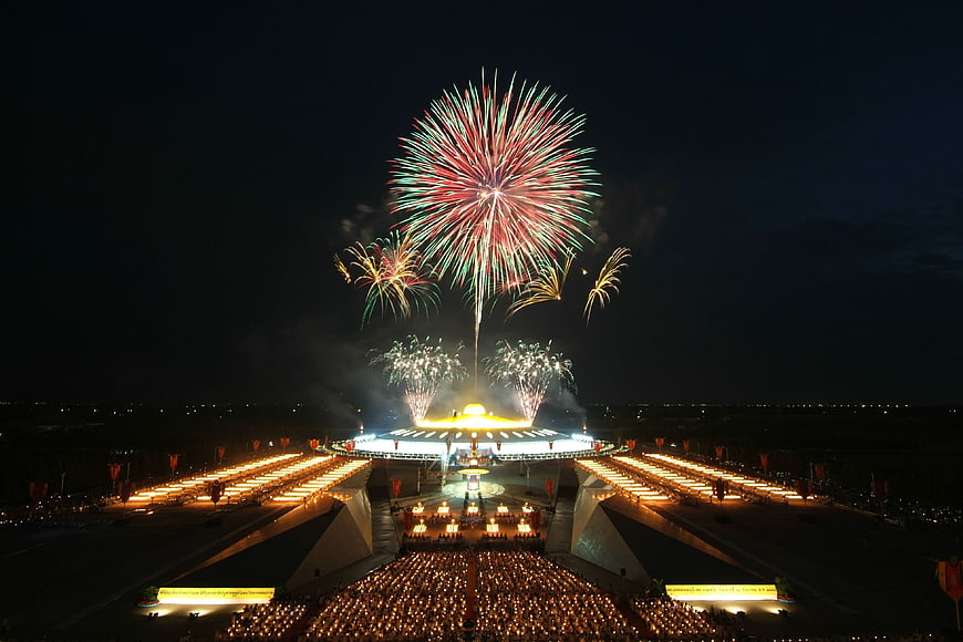 Grand Fireworks Display Over Illuminated Stadium at Night