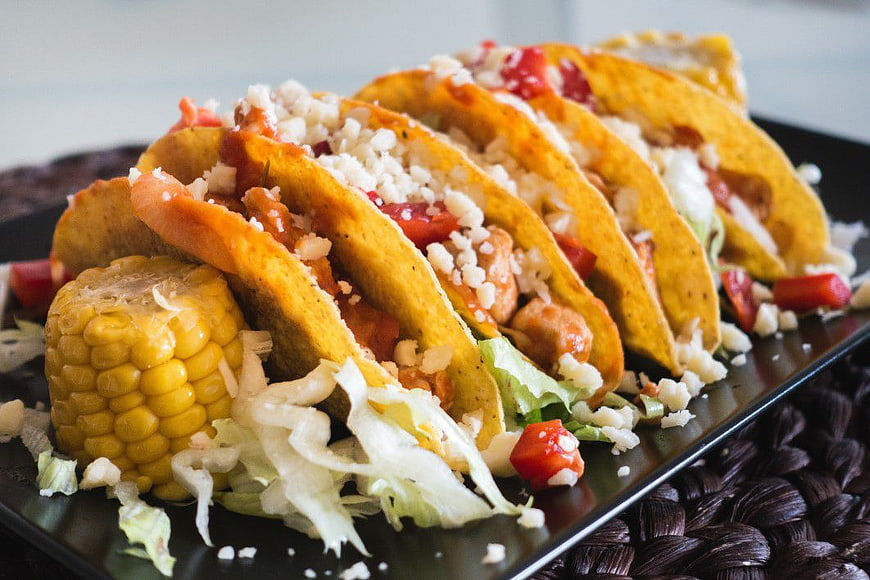Chicken Tacos with Cheese and Corn on Black Plate