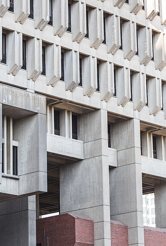 Modern Brutalist Concrete Building Facade with Geometric Windows