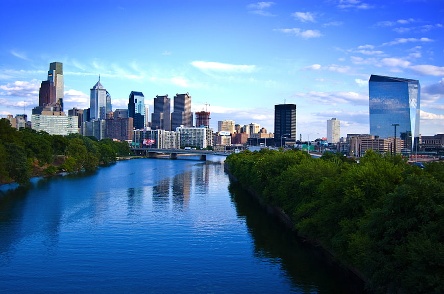 Philadelphia skyline with river and greenery