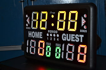 Illuminated Digital Basketball Scoreboard Displaying Game Statistics
