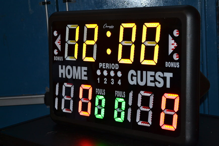 Illuminated Digital Basketball Scoreboard Displaying Game Statistics