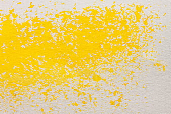 Yellow watercolor texture on white paper background