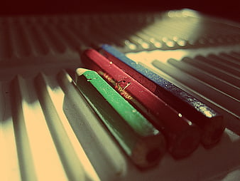 Close-up of colored pencils in a plastic case