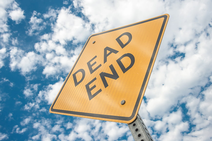 Yellow Dead End Road Sign Against Blue Sky