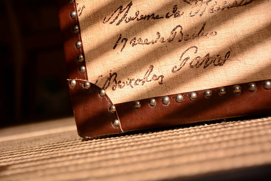 Vintage Leather Box with Handwritten Script and Sunlight