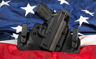 Black Pistol in IWB Holster on American Flag Background