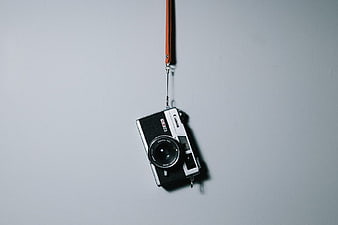 Vintage Canon Film Camera Hanging on Wall