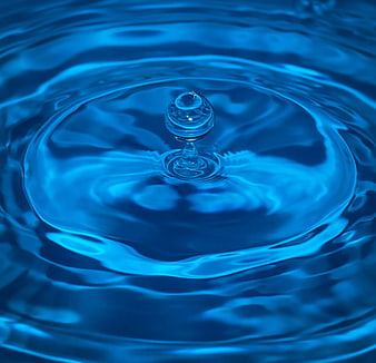 Blue water droplet splash with ripples