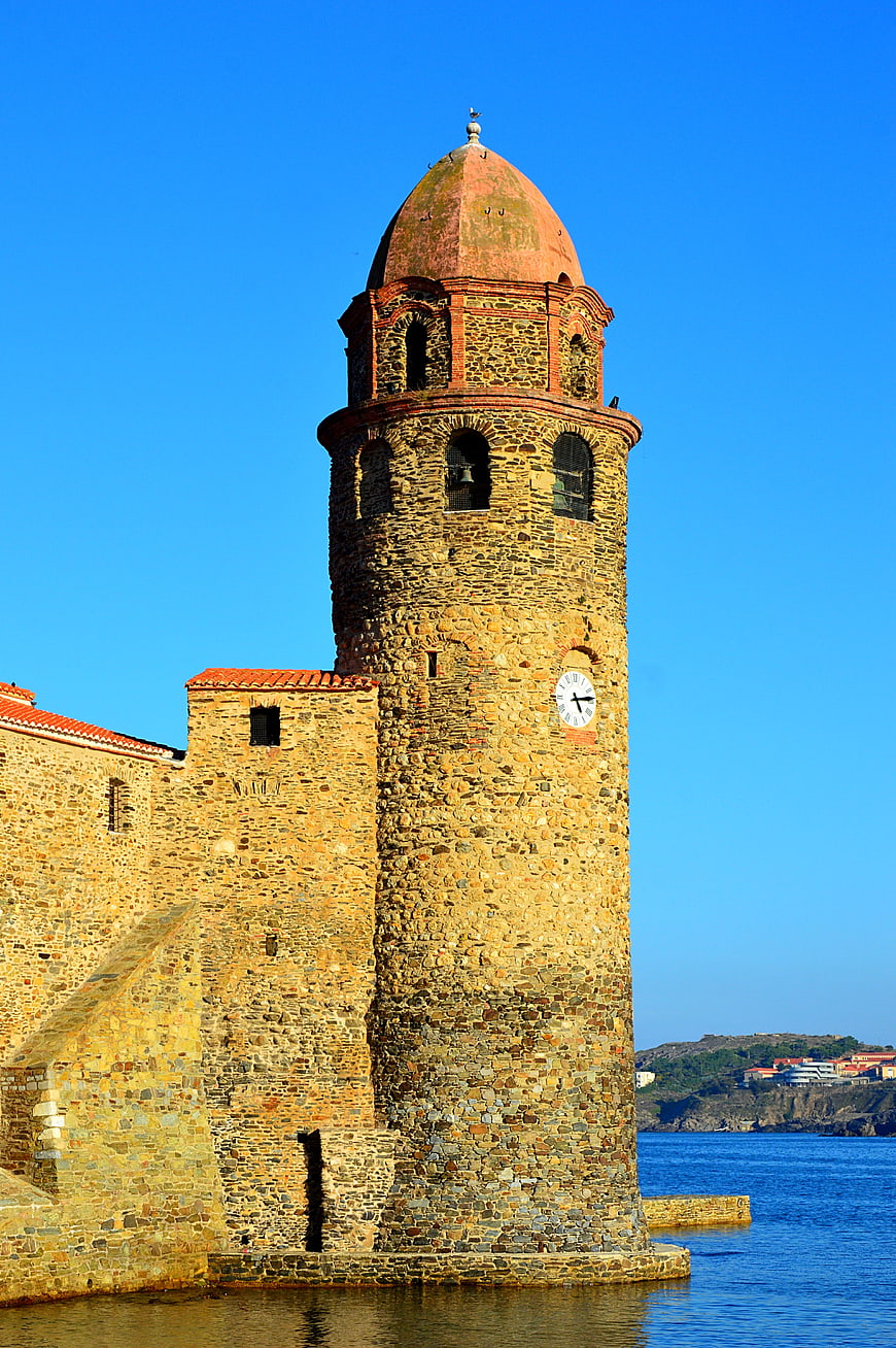 Historic stone church tower in Collioure, France by the sea