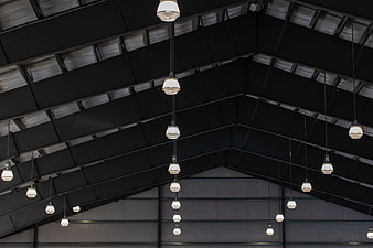 Industrial warehouse ceiling with hanging pendant lights