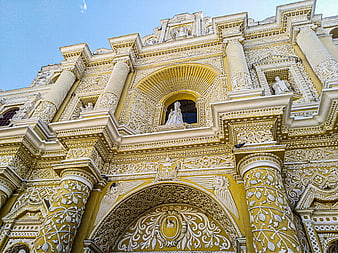 Yellow and white baroque cathedral facade in Guatemala