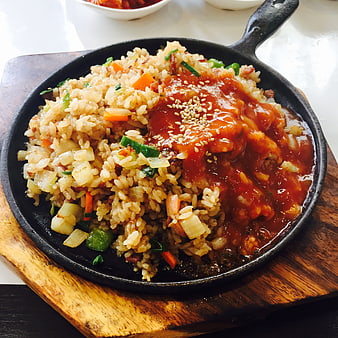 Korean fried rice with spicy sauce in cast iron skillet