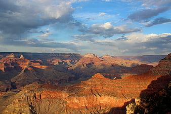 Grand Canyon landscape with dramatic clouds and red rock formations
