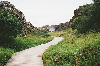 Wooden boardwalk path through rocky canyon landscape