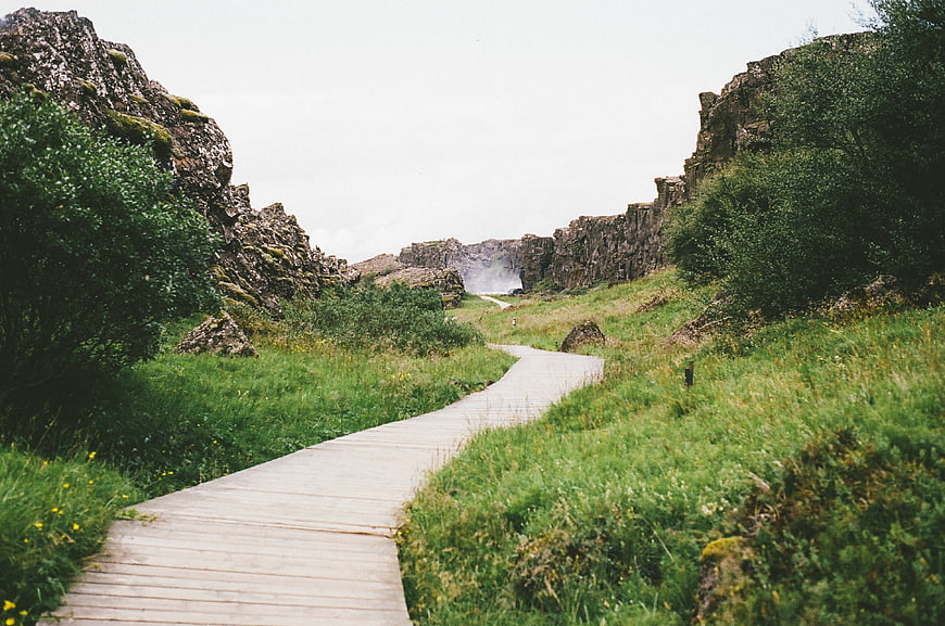 Wooden boardwalk path through rocky canyon landscape