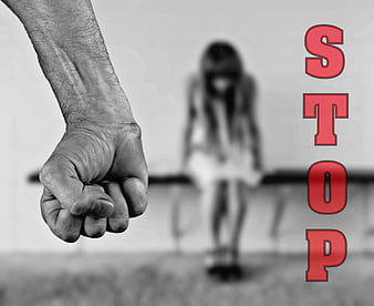 Stop Violence Against Women Fist and Blurred Girl