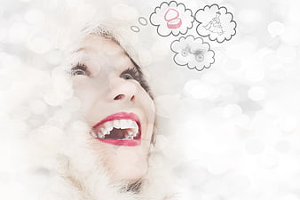 Happy woman dreaming of wedding and luxury gifts