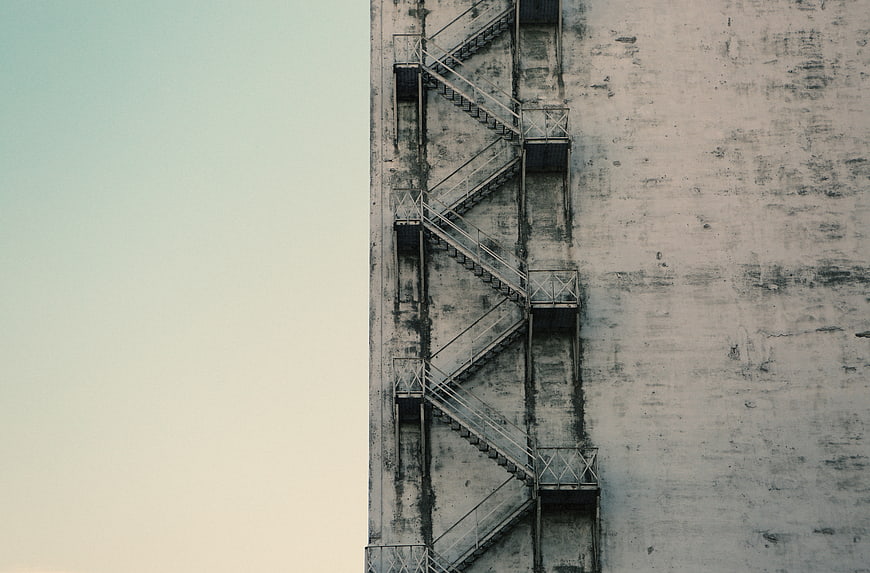 Minimalist Concrete Fire Escape Stairs Against Sky