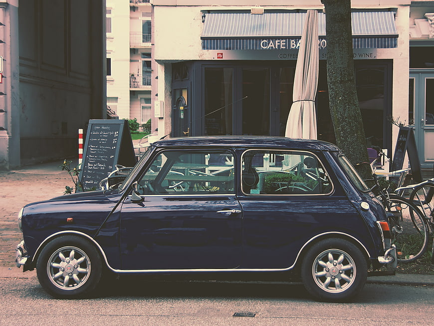 Vintage Blue Mini Cooper Parked on European Street