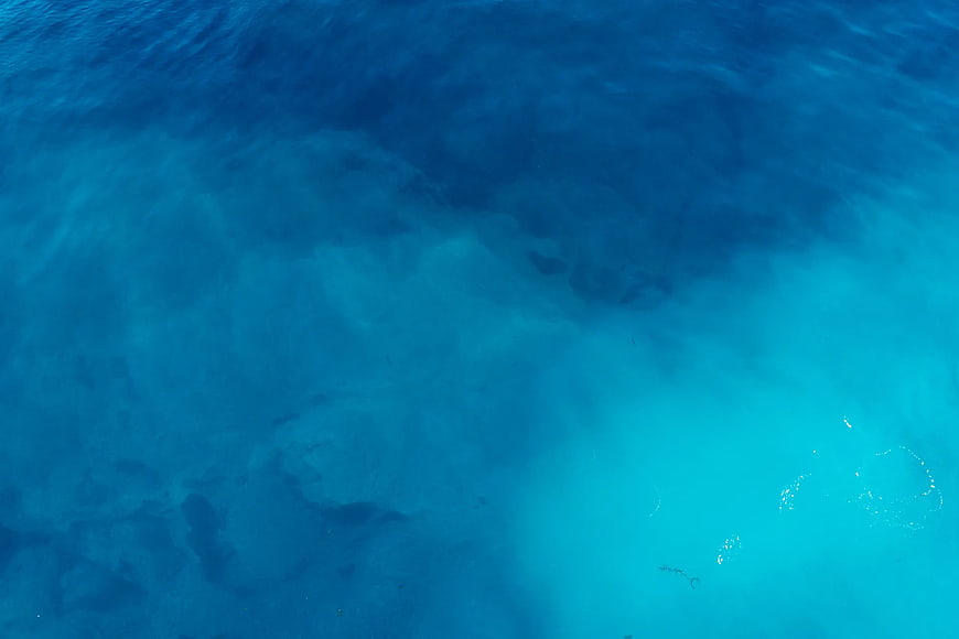 Aerial View of Turquoise and Deep Blue Ocean Water