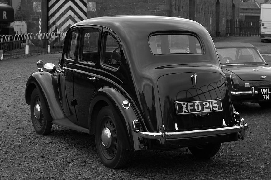 Vintage Black Classic Car Rear View on Gravel