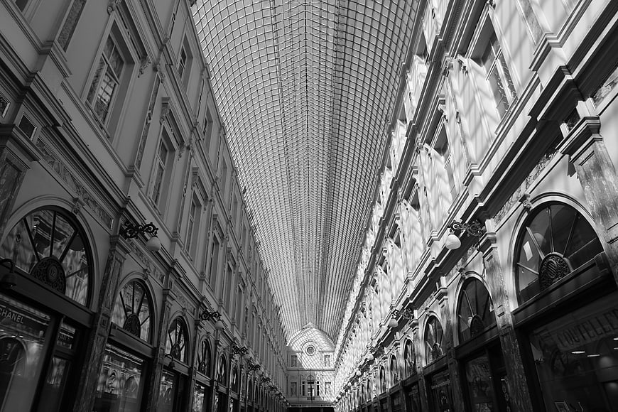 Black and white perspective of a grand shopping arcade