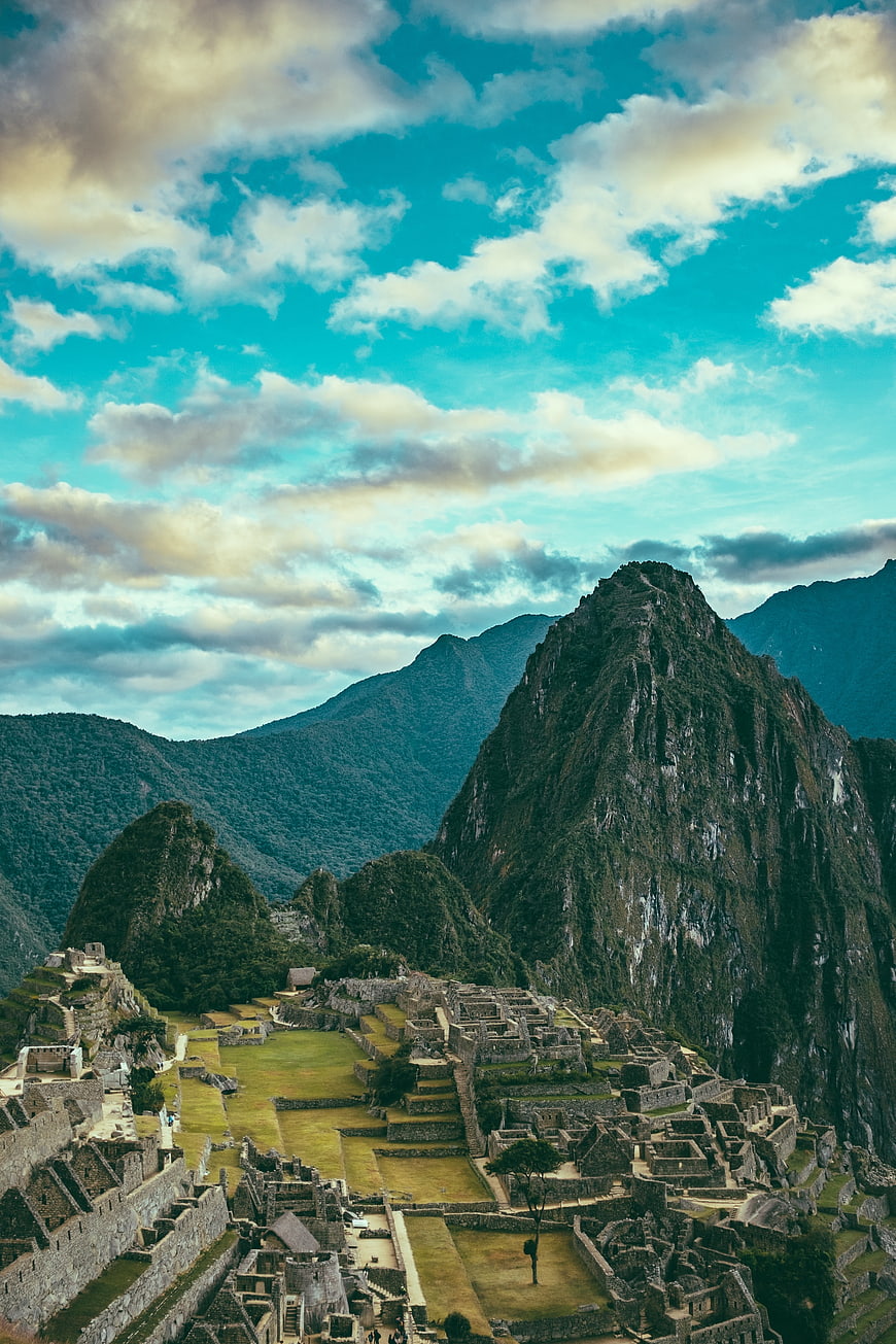 Machu Picchu ruins with Huayna Picchu mountain and blue sky