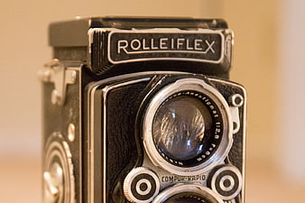 Close-up of vintage Rolleiflex camera lens and branding