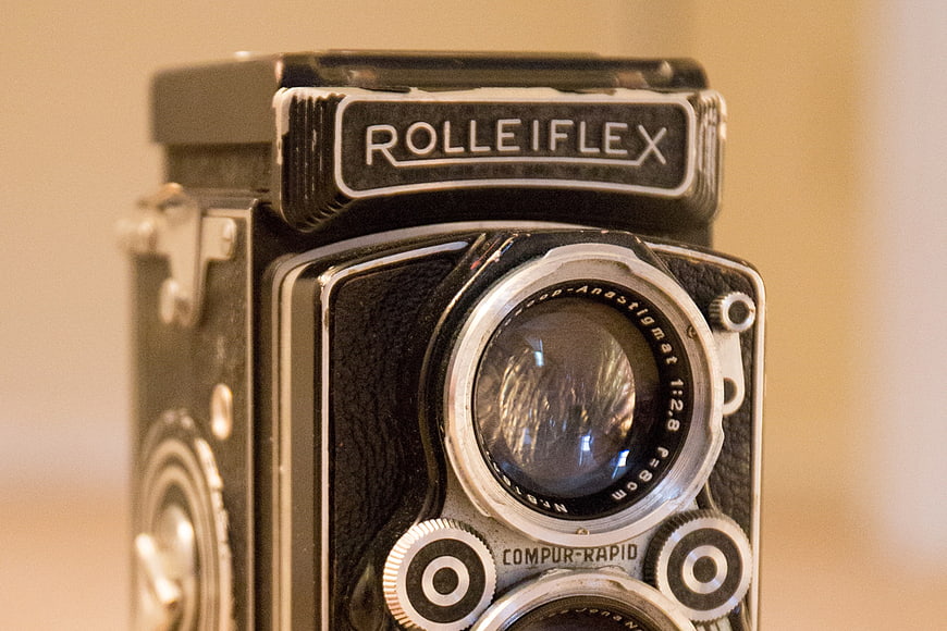 Close-up of vintage Rolleiflex camera lens and branding