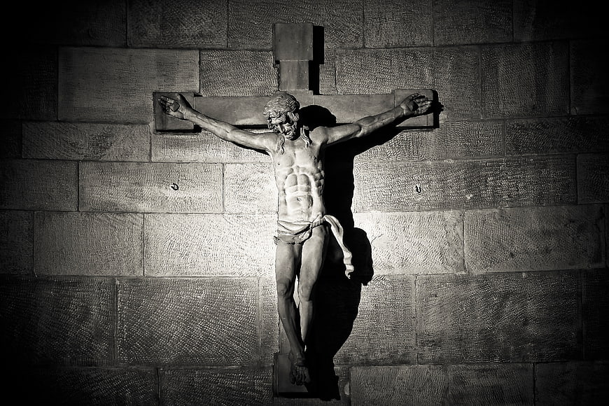 Dramatic Black and White Statue of Jesus on the Cross