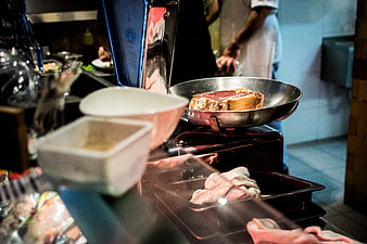Raw beef steak on kitchen scale in restaurant