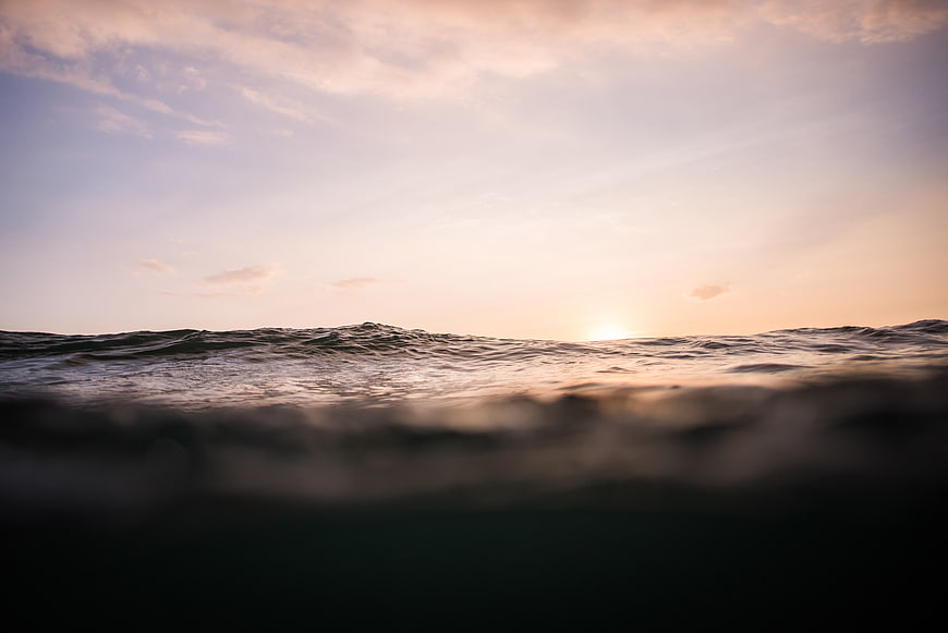 Sunset Horizon Over Calm Ocean Waves