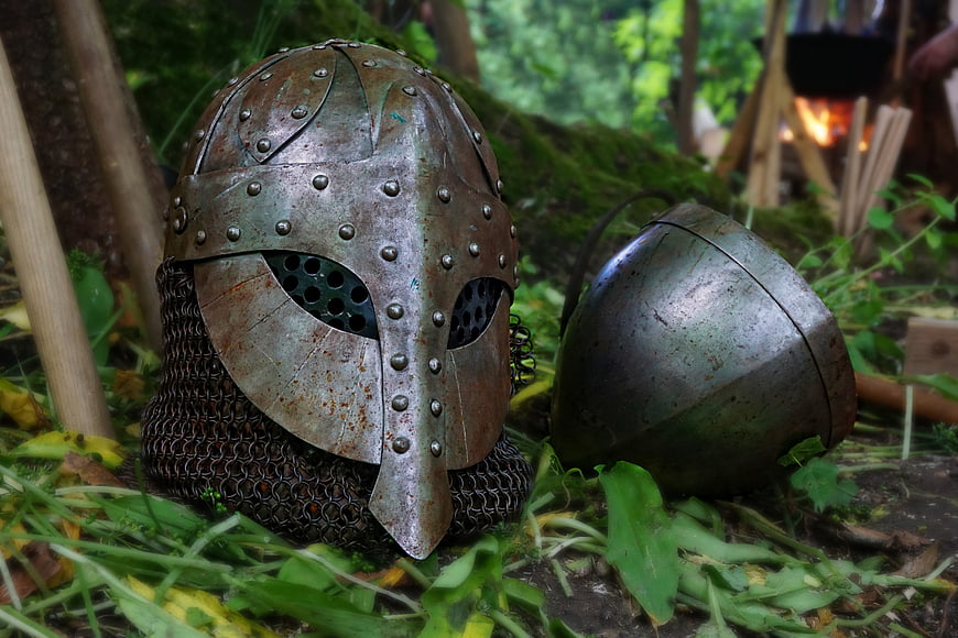 Medieval Knight Helmet And Chainmail In Mossy Forest Setting