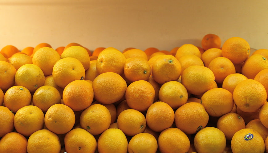 Pile of Fresh Oranges in a Crate